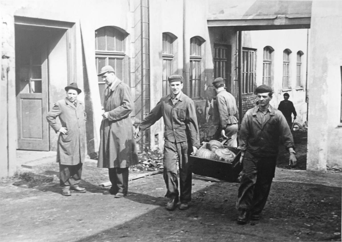 Workers carrying a chandelier