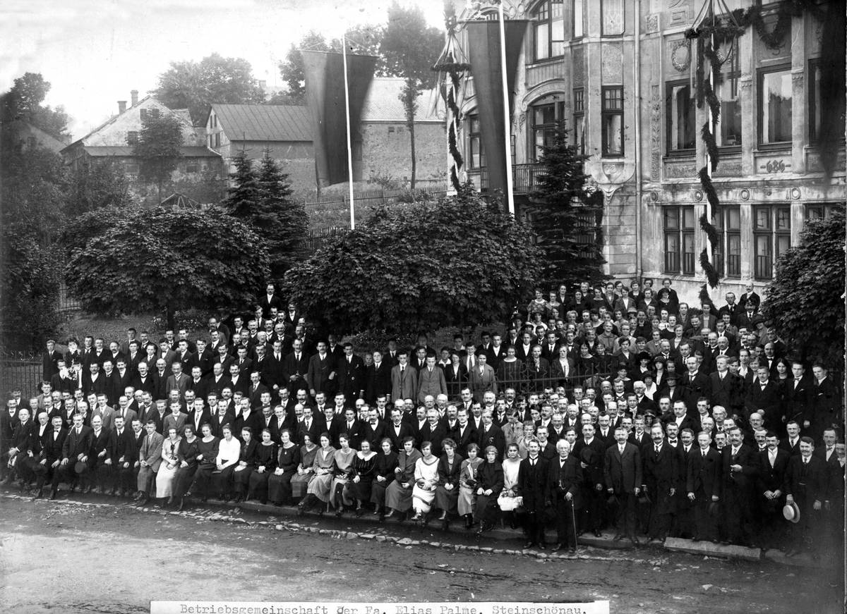 Group photograph in front of the factory
